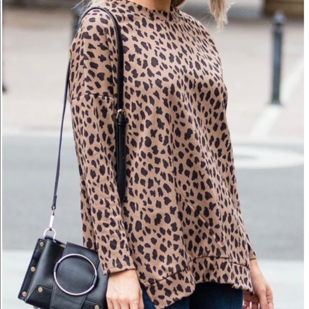 Leopard print side slit sweater NWOT.